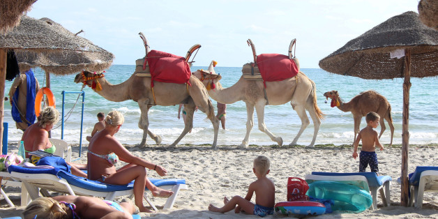 Tourists relax on a beach on the island of Djerba, Tunisia, September 7, 2016. REUTERS/Zoubeir Souissi