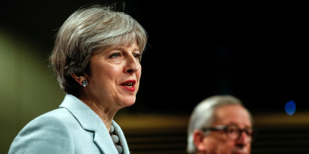 Theresa May, U.K. prime minister, left, speaks beside Jean-Claude Juncker, president of the European Commission, during a news conference at the European Commission building in Brussels, Belgium, on Friday, Dec. 8, 2017. The U.K. and the European Union struck a deal to unlock divorce negotiations, opening the way for talks on what businesses are keenest to nail down -- the nature of the post-Brexit future. Photographer: Dario Pignatelli/Bloomberg via Getty Images