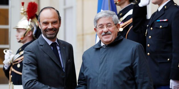 French Prime Minister Edouard Philippe (L) welcomes his Algerian counterpart Ahmed Ouyahia before a meeting at the Hotel Matignon in Paris on December 7, 2017. / AFP PHOTO / Patrick KOVARIK (Photo credit should read PATRICK KOVARIK/AFP/Getty Images)