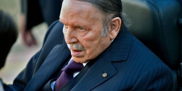 Algerian President Abdelaziz Bouteflika is seen heading to vote at a polling station in Algiers on November 23, 2017 as Algeria goes to the polls for local elections. / AFP PHOTO / RYAD KRAMDI (Photo credit should read RYAD KRAMDI/AFP/Getty Images)