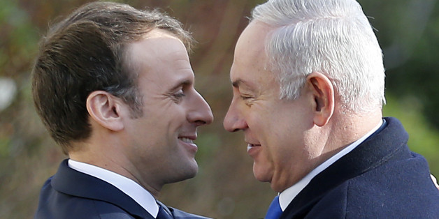 PARIS, FRANCE - DECEMBER 10: French President, Emmanuel Macron (L) welcomes Israeli Prime Minister Benjamin Netanyahu prior to their meeting at the Elysee Presidential Palace on December 10, 2017 in Paris, France. Netanyahu is on an official visit to Paris. A few days ago US President Donald Trump recognized Jerusalem as the capital of Israel and ordered that the US embassy be moved there from Tel Aviv. (Photo by Chesnot/Getty Images)
