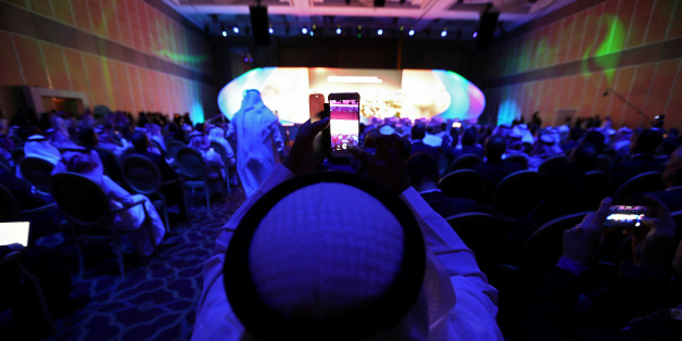 A saudi national films the inauguration with his smart phone at Saudi-US CEO Forum 2017 ahead of the arrival of the U.S. President Donald Trump, in Riyadh, Saudi Arabia May 20, 2017. REUTERS/Hamad I Mohammed