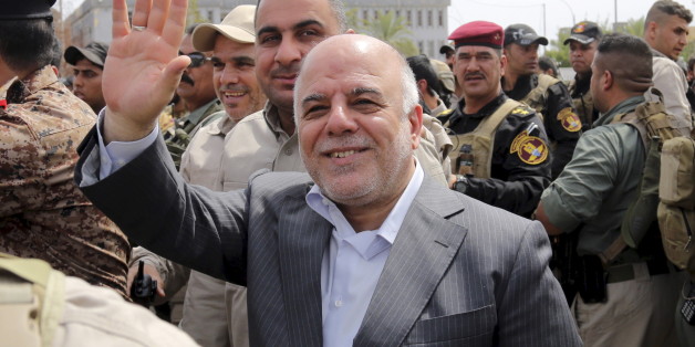 Iraq's Prime Minister Haidar al-Abadi tours the city of Tikrit after Iraq security forces regained control from Islamist State militants, April 1, 2015. Iraqi troops and Shi'ite paramilitary fighters were battling Islamic State on Wednesday in northern Tikrit, which officials described as the Sunni Muslim militant group's last stronghold in the city. REUTERS/Stringer