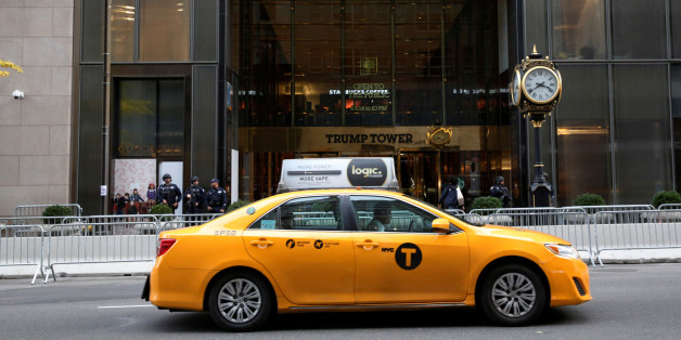 A New York City Taxi Cab passes by the security perimeter outside the Trump Tower following President-elect Donald Trump's election victory, in New York City, U.S., November 10, 2016. REUTERS/Brendan McDermid