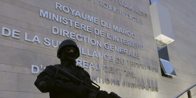 A Moroccan policeman stands guard at the Central Bureau of Judicial Investigation office in Sale, March 23, 2015. Moroccan authorities said on Monday they had dismantled a militant cell planning to create an Islamic State affiliate in the North African kingdom, seizing guns and accusing its members of plotting attacks. Reporters were shown six pistols and ammunition seized from a hideout near the southern city of Agadir, in the offices of the BCIJ in the city of Sale. REUTERS/Stringer