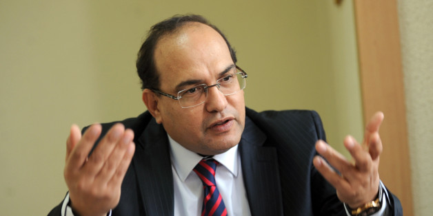 Lawyer and human rights defender Chawki Tabib, one of the contestants for the position of Tunisian Prime Minister gestures as he speaks in his office on December 4, 2013 in Tunis. Tabib, who turns 50 at the end of December, had been repeatedly proposed for the premiership by the Popular Front, a leftist grouping of opposition parties, during crisis talks with the ruling Islamists aimed at breaking months of political deadlock. AFP PHOTO / FETHI BELAID (Photo credit should read FETHI BELAI