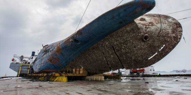 The sunken ferry Sewol on a semi-submersible transport vessel is seen during the salvage operation in waters off Jindo, South Korea. Salvage crews towed the corroded 6,800-ton South Korean ferry and loaded it onto a semi-submersible transport vessel Saturday, completing what was seen as the most difficult part of the massive effort to bring the ship back to shore nearly three years after it sank. / KOREAN MINISTRY OF OCEANS AND FISHERIES