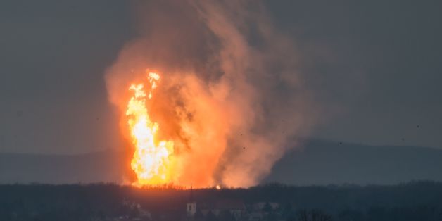 TOPSHOT - This picture taken on December 12, 2017 shows Austria's main gas pipeline hub at Baumgarten, Eastern Vienna, where an explosion rocked the site.The Kronen-Zeitung daily reported on its website that 60 people were hurt and that several fire brigades from the surrounding area were called. / AFP PHOTO / Tomas HULIK (Photo credit should read TOMAS HULIK/AFP/Getty Images)