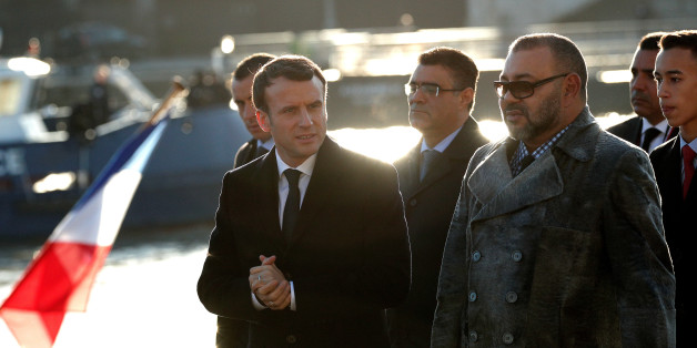 French President Emmanuel Macron (L) and Morocco's King Mohammed VI (R) board the 'Mirage' boat on the Seine river with other heads of State and government prior going to the Ile Seguin near Paris as part of the One Planet Summit, France, December 12, 2017. REUTERS/Yoan Valat/Pool