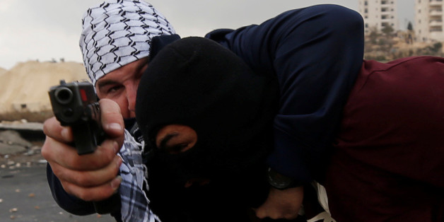 Undercover Israeli security personnel detain a Palestinian demonstrator during clashes at a protest against U.S. President Donald Trump's decision to recognize Jerusalem as the capital of Israel, near the Jewish settlement of Beit El, near the West Bank city of Ramallah December 13, 2017. REUTERS/Mohamad Torokman