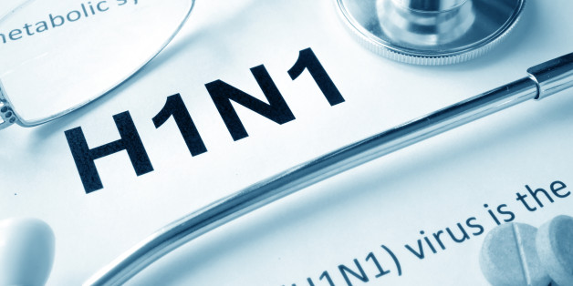 Paper with word H1N1 disease and stethoscope.