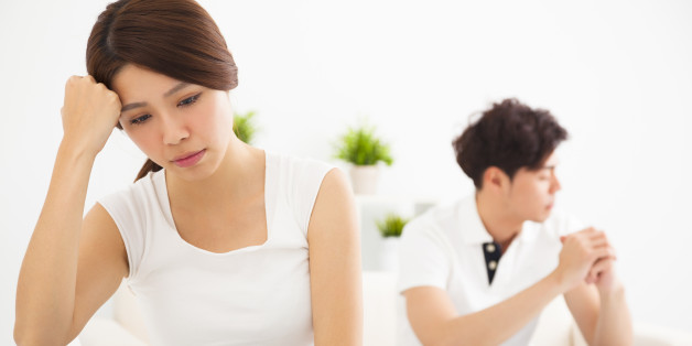 asian young Couple not talking after fight in living room