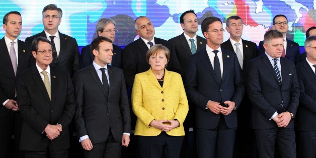 BRUSSELS, BELGIUM - DECEMBER 14: German Federal Chancellor Angela Merkel (front C), Greek Cypriot leader Nikos Anastasiadis (front L), French President Emmanuel Macron (front 2nd L) and Dutch Prime Minister Mark Rutte (front 2nd R), other officials and the Commanders of Defense Permanent Structured Cooperation (PESCO) gather to pose for a family photo after the first session of the European Summit of the Heads of State and Government of the European Union in Brussels, Belgium on December 14, 20
