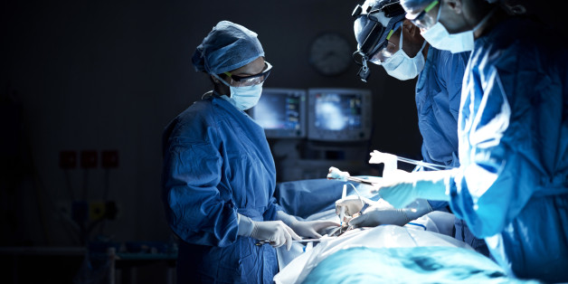 Shot of a team of surgeons performing a surgery in an operating room