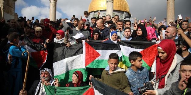 JERUSALEM - DECEMBER 15: Muslims hold a protest against U.S. President Donald Trumps announcement to recognize Jerusalem as the capital of Israel and plans to relocate the U.S. Embassy from Tel Aviv to Jerusalem, after performing the Friday Prayer at al-Aqsa Mosque compound in Jerusalem on December 15, 2017. (Photo by Mostafa Alkharouf/Anadolu Agency/Getty Images)