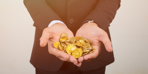 The money coin on hands or coins exchange in stock market.