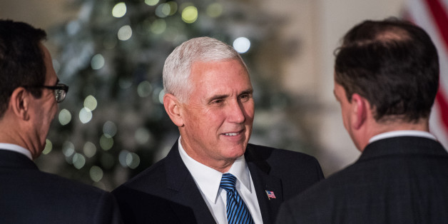 WASHINGTON, DC - DECEMBER 13: Vice President Mike Pence shake hands before President Donald Trump make remarks on tax reform at the Grand Foyer of the White House on Wednesday, Dec. 13, 2017, in Washington. (Photo by Salwan Georges/The Washington Post via Getty Images)