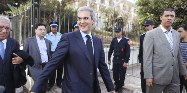 Prince Moulay Hicham, cousin of Morocco's King Mohammed VI, is accompanied by his lawyer Abderrahim Berrada (L) as they leave the Ain Sebaa Court in Casablanca September 17, 2012. The Moroccan Prince has filed a lawsuit against Member of Parliament Abdelhadi Khairat on grounds of defamation. REUTERS/Macao (MOROCCO - Tags: POLITICS CRIME LAW)
