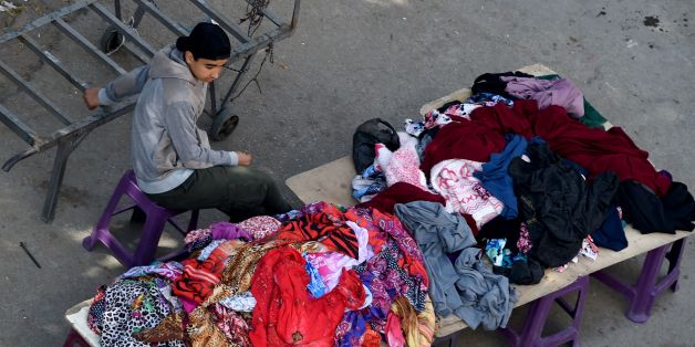 A Tunisian boy sells clothes at a market in the centre of Tunis on April 14, 2017.
On April 14, 2017, Tunisia launched a project against child labour which is on the rise according to the Minister of Social Affairs, Mohamed Trabelsi. / AFP PHOTO / FETHI BELAID (Photo credit should read FETHI BELAID/AFP/Getty Images)