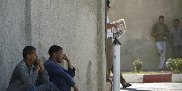 Men wait for casual work offers on a street of Cheraga, west of Algiers, June 24, 2010. Local officials say that Islamist insurgents, fighting a lingering conflict with Algeria's security forces, are targeting small armies of unemployed young men and persuading some of them to join their ranks across Algeria. To match Feature SECURITY-QAEDA/ALGERIA REUTERS/Louafi Larbi (ALGERIA - Tags: CIVIL UNREST POLITICS IMAGES OF THE DAY)