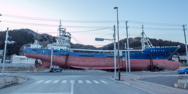 Kesenuma, Japan - February 03, 2013: This picture was taken 1 year and 11 moths after 2011 Tohoku earthquake and tsunami disaster, giving an idea of the destruction that the tsunami left on the territory. 330-ton trawler Kyotomaru was swept around 500 meters inland by the tsunami on March 11, 2011. It also survived a subsequent fire that engulfed the small city on Japanâs northeast coast. The ship was dismantled 7 month after this shot around 2013 September.