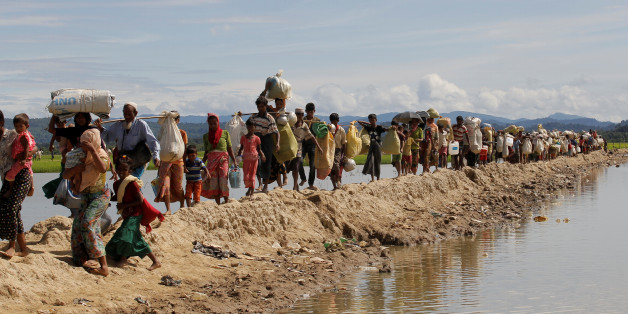 Rohingya refugees, who crossed the border from Myanmar two days before, walk after they received permission from the Bangladeshi army to continue their way to the refugee camps, in Palang Khali near Cox's Bazar, Bangladesh October 19, 2017. REUTERS/ Zohra Bensemra