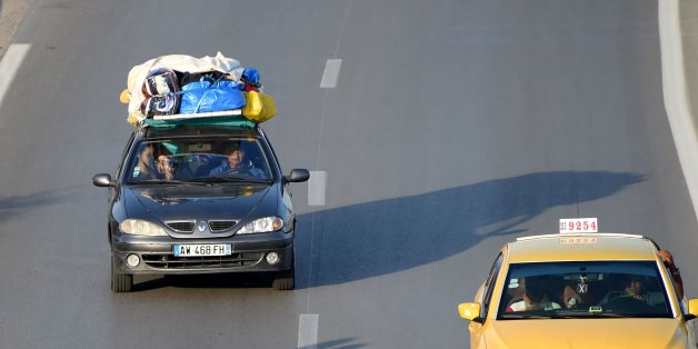 Tunisians return from the beach on the motorway from the port city of La Goulette to Tunis on the outskirts of the Tunisian capital on July 12, 2016. Run-down roads, reckless driving and poor vehicle maintenance are all being blamed for a spike in deadly traffic accidents in Tunisia that has safety experts worried. Road traffic deaths rose by nine percent in the first five months of this year compared with 2015, sparking calls for tougher measures to crack down on widespread traffic offences. /