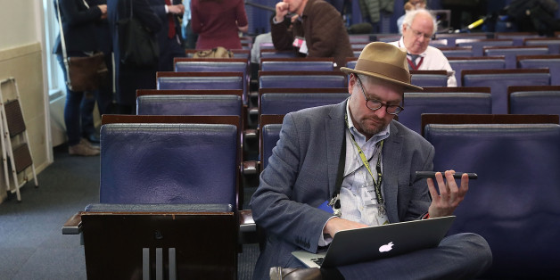 WASHINGTON, DC - FEBRUARY 24: New York Times reporter Glenn Thrush works in the Brady Briefing Room after being excluded from a press gaggle by White House Press Secretary Sean Spicer, on February 24, 2017 in Washington, DC. The New York Times, Los Angeles Times, CNN and Politico were also excluded from the off camera gaggle. (Photo by Mark Wilson/Getty Images)