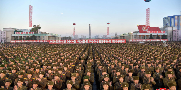 TOPSHOT - This December 1, 2017 picture released by North Korea's official Korean Central News Agency (KCNA) on December 2, 2017 shows North Korean soldiers and Pyongyang residents holding a rally to celebrate the North's declaration on November 29 it had achieved full nuclear statehood.North Korea's leader Kim Jong-Un declared the country had achieved a 'historic cause' of becoming a nuclear state, its state media said on November 29, after the country tested an intercontinental ballistic missi