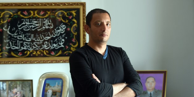 Tunisian blogger Yassine Ayari poses for a picture at home on April 17, 2015 in Tunis. Tunisian authorities have released a blogger handed six months in prison for defaming the army, after he served more than half his sentence, his brother said. AFP PHOTO / FETHI BELAID (Photo credit should read FETHI BELAID/AFP/Getty Images)