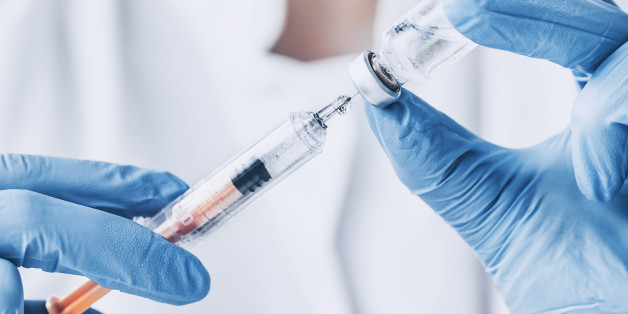 injecting injection vaccine vaccination medicine flu man doctor insulin health drug influenza concept - stock image