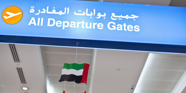 DUBAI, AIRPORT, United Arab Emirates - DECEMBER 25: A sign for the departure gates with the national flag and a portrait of the ruling sheikhs at Dubai Airport on December 25, 2011 in Dubai, United Arab Emirates (Photo by EyesWideOpen/Getty Images)