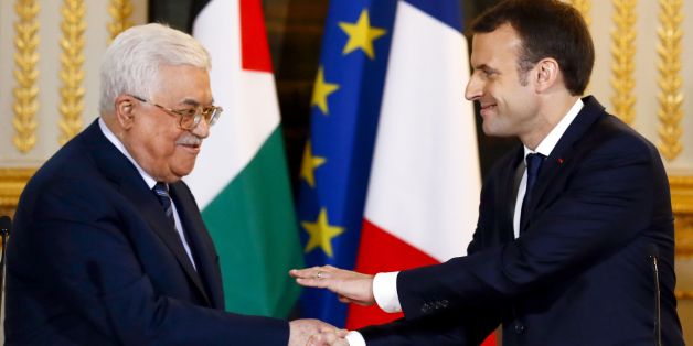French President Emmanuel Macron (R) shakes hands with Palestinian President Mahmud Abbas at the end of a joint press conference following their meeting at the Elysee presidential Palace, in Paris, on December 22, 2017.Abbas visits France in the hopes that France takes a leading role in opposing the US recognition of Jerusalem as Israels capital. / AFP PHOTO / POOL / Francois Mori (Photo credit should read FRANCOIS MORI/AFP/Getty Images)