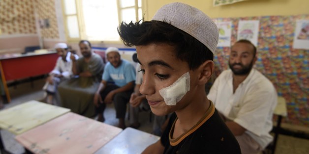 An Algerian youth from the Berber community stands at school where families took shelter on July 10, 2015, after their homes have been damaged during clashes between Berbers and Arabs in the Algerian town of Guerara in the M'zab valley. Algerian authorities have arrested 38 people in connection with deadly ethnic unrest between Berbers and Arabs in the south of the country, police and the gendarmerie said. AFP PHOTO / FAROUK BATICHE (Photo credit should read FAROUK BATICHE/AFP/Getty Image