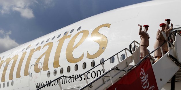 Emirates cabin crew board an Emirates Airbus A380-800 at Manchester Airport in Manchester, northern England, September 1, 2010. Manchester Airport became the world's first regional airport to have a regular A380 service, according to an airport press release. REUTERS/Phil Noble (BRITAIN - Tags: TRANSPORT BUSINESS TRAVEL)
