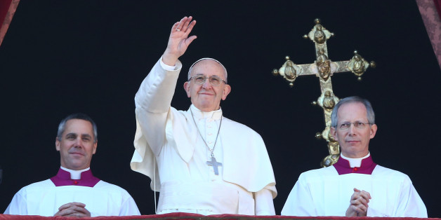 Pope Francis waves as he leads the "Urbi et Orbi" (to the city and the world) message from the balcony overlooking St. Peter's Square at the Vatican December 25, 2017. REUTERS/Alessandro Bianchi