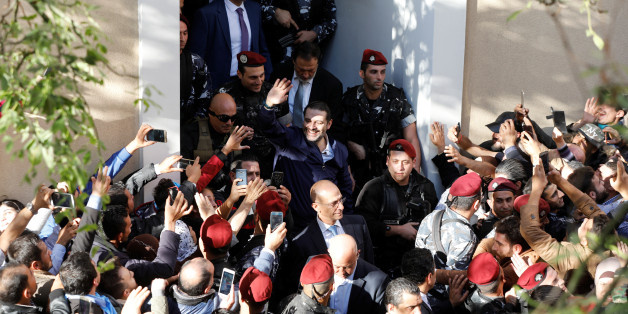 Saad al-Hariri, who suspended his decision to resign as prime minister, gestures to his supporters at his home in Beirut, Lebanon November 22, 2017. REUTERS/Jamal Saidi