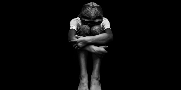 Young Asian boy, scared and alone. Hoping for a better future than the one that seems set. He is at high risk of being physically, mentally and emotionally abused and also trafficked.