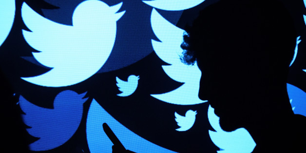 LONDON, ENGLAND - AUGUST 09: In this photo illustration, the logo for the Twitter social media network is projected onto a man on August 09, 2017 in London, England. With around 328 million users worldwide, Twitter has gone from a small start-up in for the public 2006 to a broadcast tool of politicians and corporations in 2017. (Photo by Leon Neal/Getty Images)