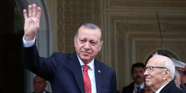 Turkey's President Tayyip Erdogan gestures to photographers at Carthage Palace in Tunis, Tunisia, December 27, 2017. REUTERS/Zoubeir Souissi