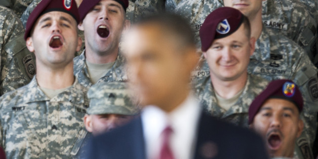 Troops yell in support at U.S. President Barack Obama as he speaks at Fort Bragg in Fayetteville, North Carolina December 14, 2011. REUTERS/Chris Keane (UNITED STATES - Tags: POLITICS MILITARY)