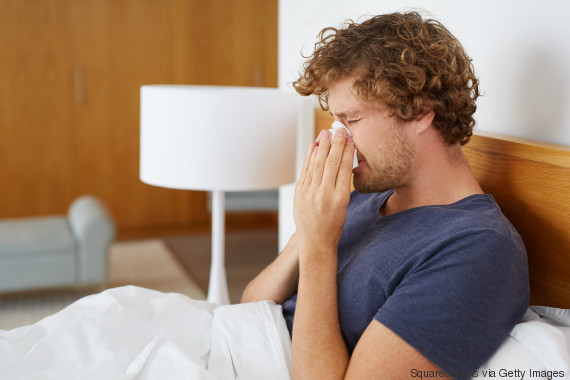 man sneezing