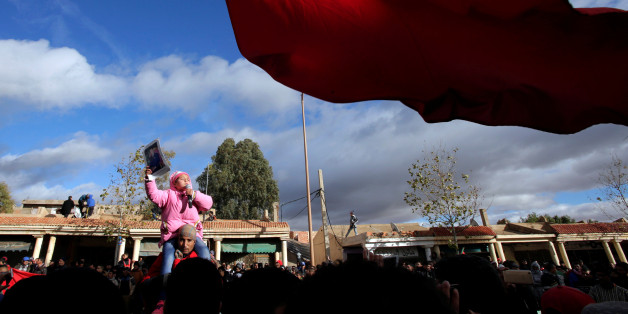 People shout slogans during a protest after two miners died while working in a clandestine coal mine, in Jerada, Morocco December 28, 2017. REUTERS/Youssef Boudlal