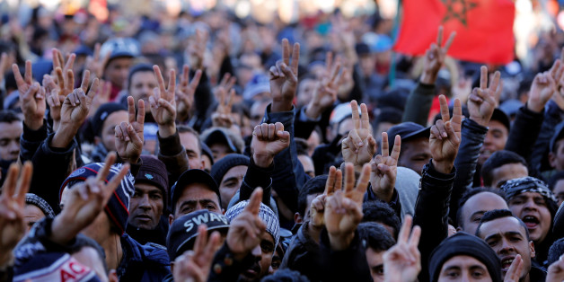 People shout slogans during a protest after two miners died while working in a clandestine coal mine, in Jerada, Morocco December 28, 2017. REUTERS/Youssef Boudlal