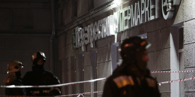 Russian Emergency Ministry members gather outside a supermarket after an explosion in St Petersburg, Russia December 27, 2017. REUTERS/Anton Vaganov