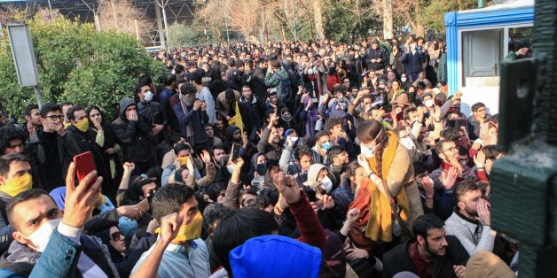 Iranian students protest at the University of Tehran during a demonstration driven by anger over economic problems, in the capital Tehran on December 30, 2017.Students protested in a third day of demonstrations, videos on social media showed, but were outnumbered by counter-demonstrators. / AFP PHOTO / STR (Photo credit should read STR/AFP/Getty Images)