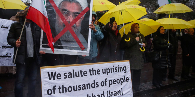 Opponents of Iranian President Hassan Rouhani hold a protest outside the Iranian embassy in west London, December 31, 2017. REUTERS/Eddie Keogh