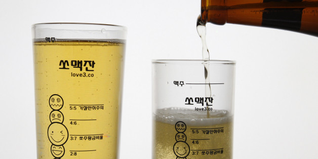Glass measuring cups which have markings for mixing and cartoon faces for each different combination are seen in this picture illustration at the cup seller Love3's factory in Seoul June 7, 2011. Somaek, the mix of Korea's national alcohol soju -- a distilled vodka-like liquor -- with beer, is a popular tipple for many Koreans who find straight soju too strong, but aren't that keen on beer by itself. As a result, one lively debate when Koreans gather to drink is the best ratio of the concoction. For some, pouring soju and beer into glasses is a chance to brag about their mixology skills and prime somaek combinations. But now, a new glass measuring cup takes the mystery out of making the concoction, allowing partiers to mix according to their favourite taste every time. The cup provides guides for all possible permutations, from the 1:9 soju to beer mix described as "gentle and smooth" up to "Blackout" -- a 5:5 mix. Picture taken on June 7, 2011. To match Reuters Life! KOREA-DRINKING/ REUTERS/Truth Leem (SOUTH KOREA - Tags: SOCIETY)