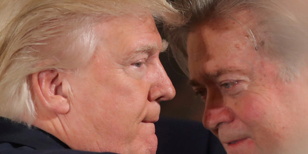 FILE PHOTO: U.S. President Donald Trump talks to chief strategist Steve Bannon during a swearing in ceremony for senior staff at the White House in Washington, U.S. January 22, 2017. REUTERS/Carlos Barria/FILE PHOTO TPX IMAGES OF THE DAY