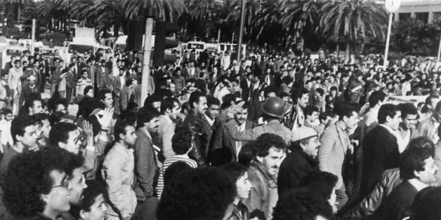 Picture released on January 5, 1984 shows Tunisian people gathering in the streets of Tunis after Tunisian president Habib Bourguiba appeared on radio and television to announce a new budget to avoid excessive price increases for food staples and that price rises would be rescinded. Violent protest demonstrations against the increase in the price of bread and basic food products, the 'Tunisian Bread riots', began on January 1, 1984 when price rises were officially announced and a state of emerge